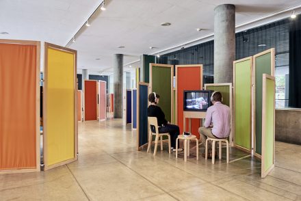  Renée Green. Media Bichos/Wavelinks, Carpenter Center for the Visual Arts, Harvard University, Level 1. Installation view. Media Bichos. 2012-13. Wood frames, textiles, tables, and seating. Dimensions variable. The ​Museum of Modern Art, New York. Study Collection. 