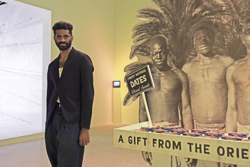 Christopher Joshua Benton with his work ‘The World Was My Garden’ which maps the circulation of dates as a commodity. Vidhyaa Chandramohan / The National